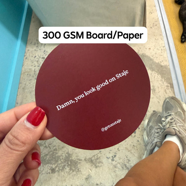 Custom printed burgundy Staje coaster reading 'Damn, you look good on Staje' on 300gsm board - branded event coasters